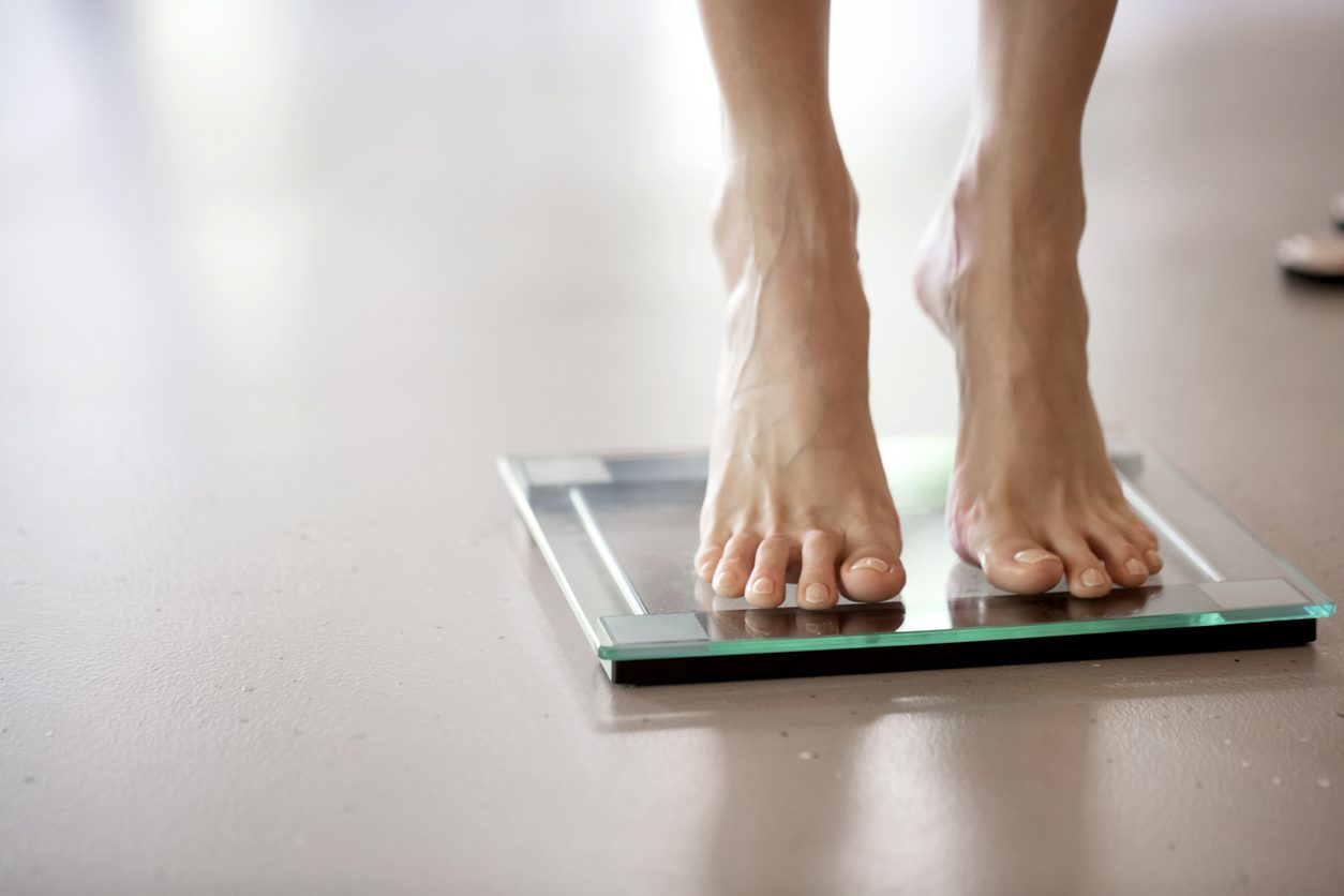 Bathroom scale with measuring tape